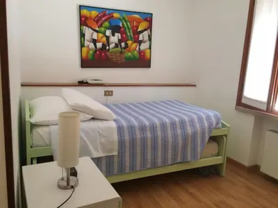 Letto o letti in una camera di Locanda Trattoria Caffè Cavour