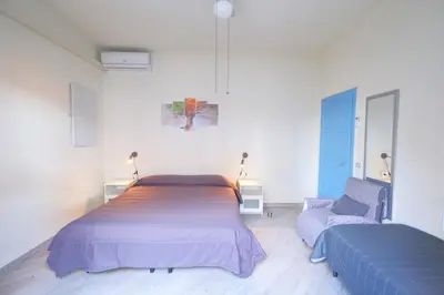 Letto o letti in una camera di CASA ROSSA tre camere in centro