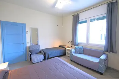 Letto o letti in una camera di CASA ROSSA tre camere in centro