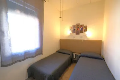 Letto o letti in una camera di CASA ROSSA tre camere in centro
