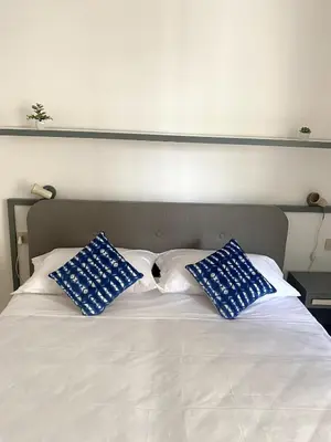 Letto o letti in una camera di Fronte Mare Apartment Private Beach & Free Park