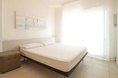 Letto o letti in una camera di Laguna Park - QUI VENDE Immobiliare - per solo Famiglie