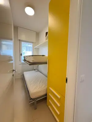 Letto o letti in una camera di VILLA SMERALDA-Solo per famiglie- WALTERIGATO APARTMENTS
