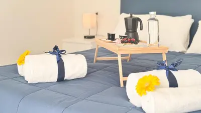 Letto o letti in una camera di Casa Bea by Ca-Sa Check