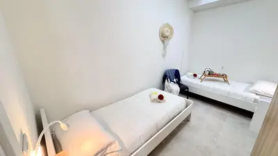 Letto o letti in una camera di Casa Bea by Ca-Sa Check