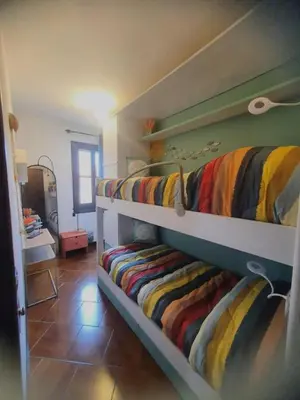 Letto o letti in una camera di Ca' del Bovolo