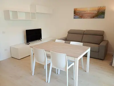 TV o dispositivi per l'intrattenimento presso Residence Florinas con piscina - Family Apartments Lido di Jesolo