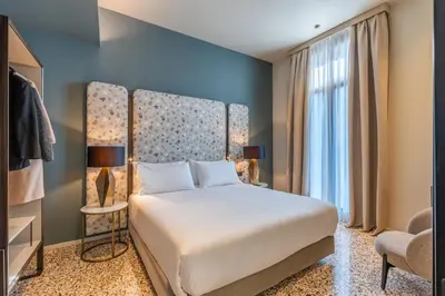 Letto o letti in una camera di Palazzo Rota Luxury Apartments