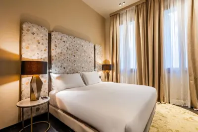 Letto o letti in una camera di Palazzo Rota Luxury Apartments