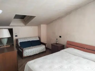 Letto o letti in una camera di Casa Sandra