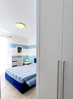 Letto o letti in una camera di HOLA borgo dei fiori