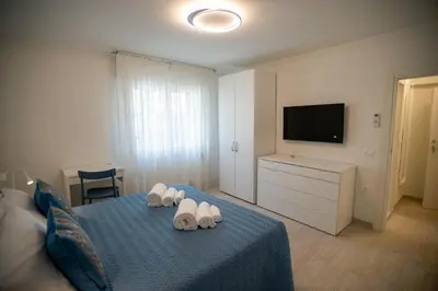 Letto o letti in una camera di CASA LILLY camere matrimoniali con bagno privato
