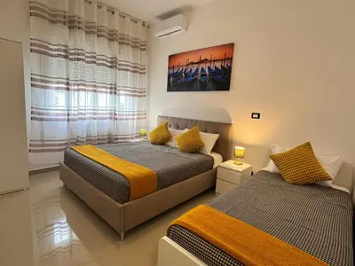 Letto o letti in una camera di Casa Duca D'aosta