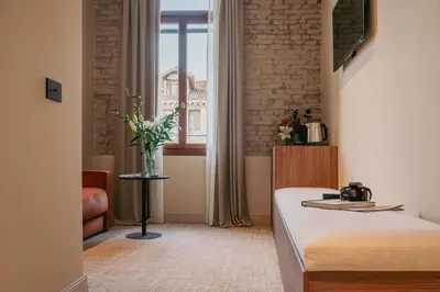 Letto o letti in una camera di Rimon Place Kosher