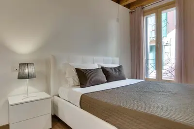 Letto o letti in una camera di Appartamento Arco
