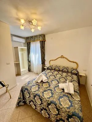 Letto o letti in una camera di Ca' Antico Monastero