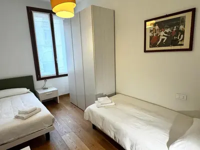 Letto o letti in una camera di Palazzo Margherita