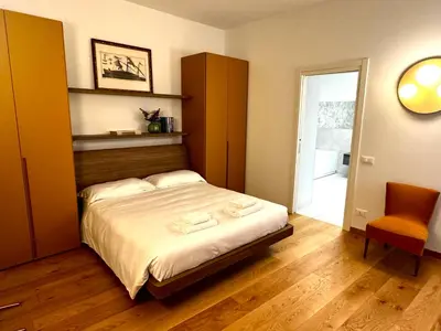 Letto o letti in una camera di Palazzo Margherita