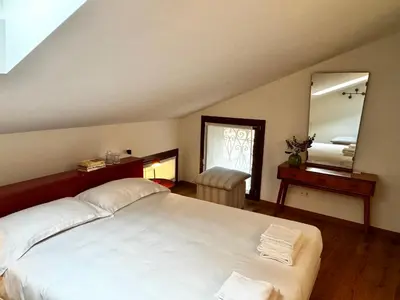 Letto o letti in una camera di Palazzo Margherita