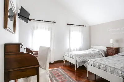 Letto o letti in una camera di La Dimora di Lara B&B