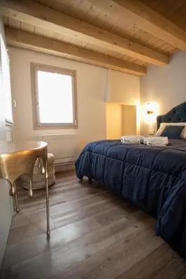 Letto o letti in una camera di CA' del SAL LUXURY APARTMENTS