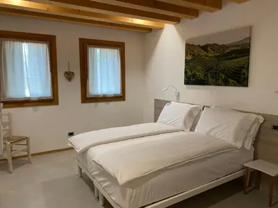 Letto o letti in una camera di Agrialloggio Cantina Piccolin