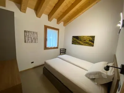 Letto o letti in una camera di Agrialloggio Cantina Piccolin