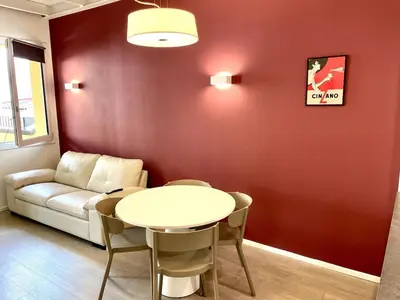 Area soggiorno di Elegant One-Bedroom Apartment with Private Terrace- steps from Basilica del Santo