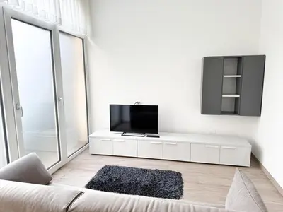 TV o dispositivi per l'intrattenimento presso Two-bedroom within walking distance of the center