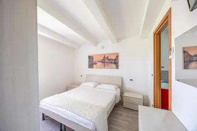 Letto o letti in una camera di Villetta ai Pini by Venicevillas