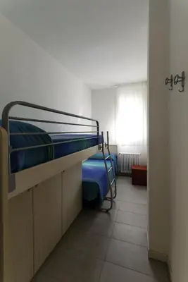 Letto o letti in una camera di Villa Faro Vecchio