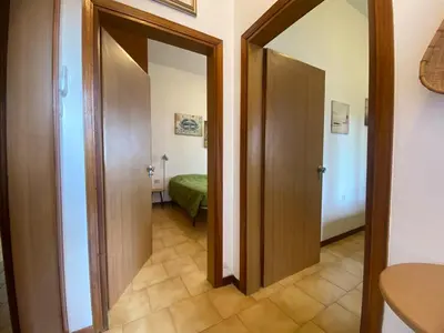 Letto o letti in una camera di Jesolo Via Gozzi