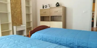 Letto o letti in una camera di Casa Maria