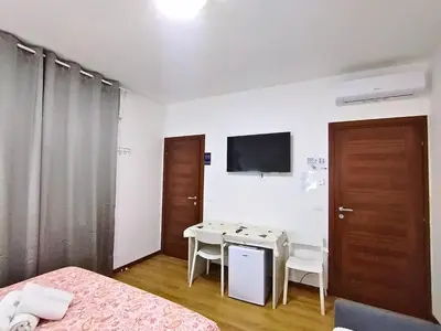 TV o dispositivi per l'intrattenimento presso Magnolia Boutique Luxury Rooms