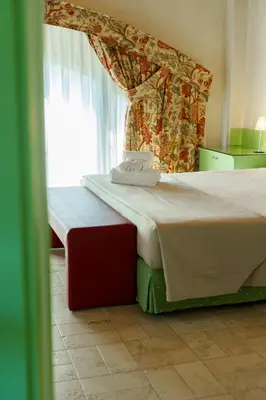 Letto o letti in una camera di Villa Luisa Francesca