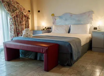 Letto o letti in una camera di Villa Luisa Francesca