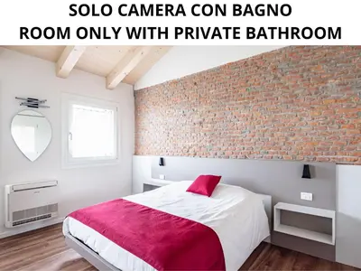 Letto o letti in una camera di Ca' Mia - Casa Belfiore