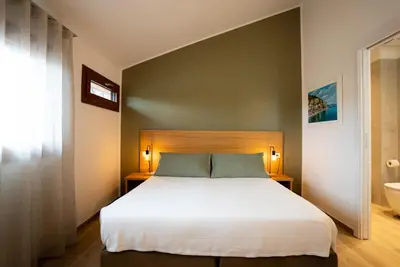 Letto o letti in una camera di Locanda 19 al paradiso