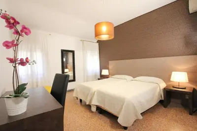 Letto o letti in una camera di Residence San Marco