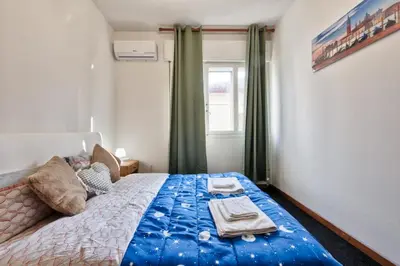 Letto o letti in una camera di Cozy Miranese Venice Apartment
