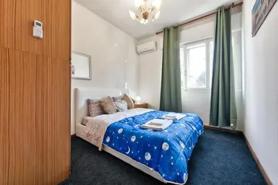 Letto o letti in una camera di Cozy Miranese Venice Apartment