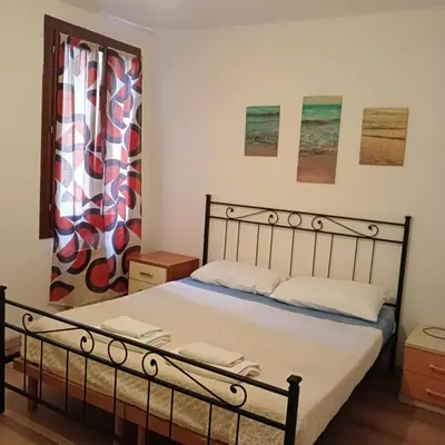 Letto o letti in una camera di Casa Aurora