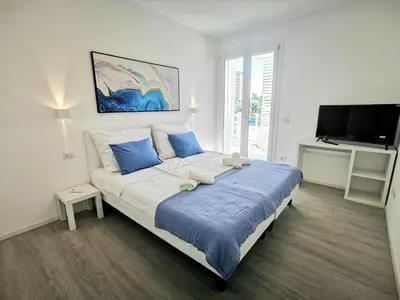 Letto o letti in una camera di Piscina Fronte Mare & Terrazza - JL Blue Apartments C25