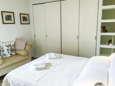 Letto o letti in una camera di Ca Farnese, beautiful big apartment in trad area