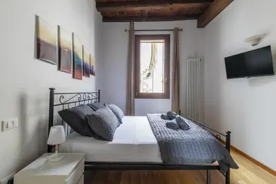 Letto o letti in una camera di i-HOMES Pigafetta Apartment