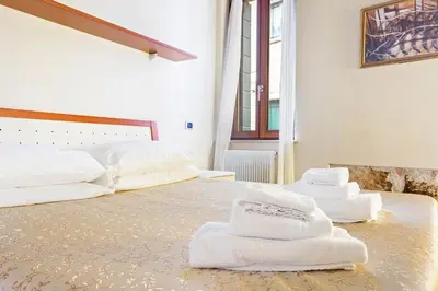 Letto o letti in una camera di Best Venice Apartments Torre dell'Orologio