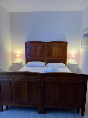 Letto o letti in una camera di Artemide Relais