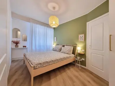 Letto o letti in una camera di 'Suite San Nicolò' -Treviso Historic Center with Parking Space - 10 min walking to Train Station