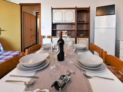 TV o dispositivi per l'intrattenimento presso Pleasant seaside flat in Rosolina Mare