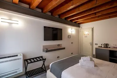 Letto o letti in una camera di GuestHost - Santo 86 Luxury Rooms